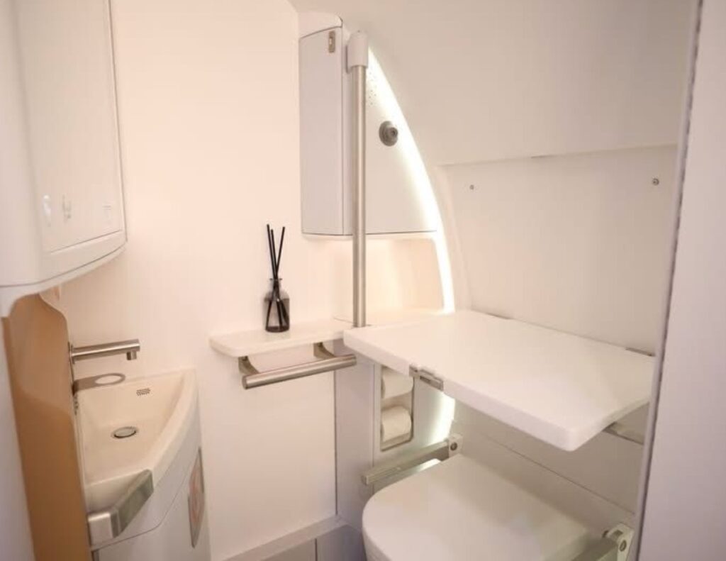 Inside the ACCESS expandable lavatory on ST Engineering's stand at AIX 2025. The space is well designed with features multiple grab bars for Disabled passengers.
